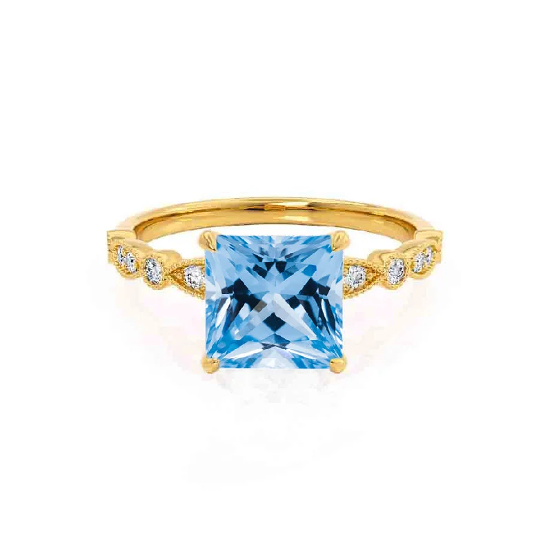 contemporary engagement rings-HOPE - Chatham® Princess Aqua Spinel & Diamond 18k Yellow Gold Vintage Shoulder Set