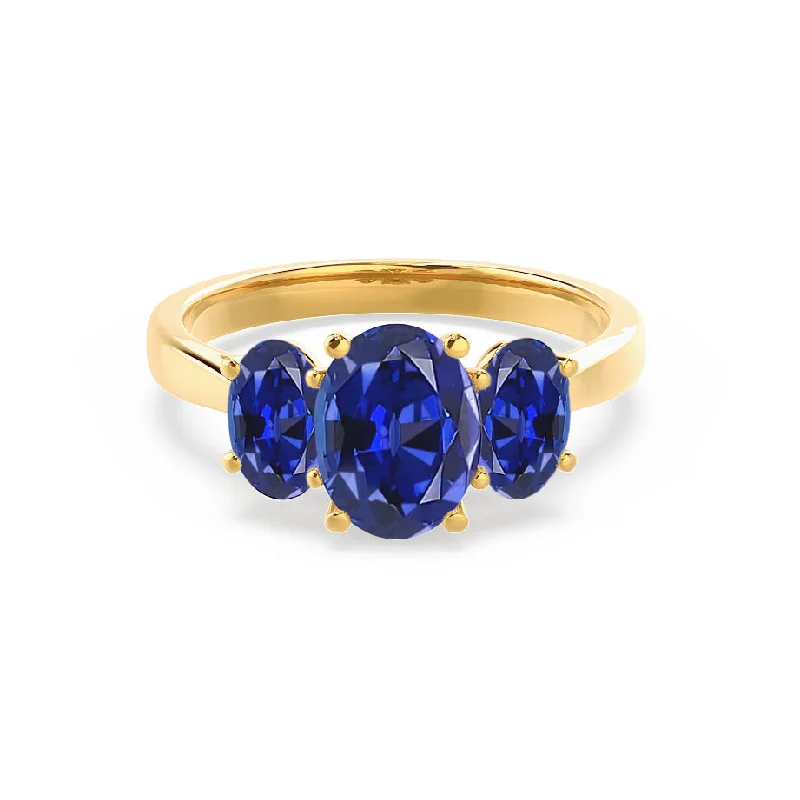 art deco engagement rings-EVERDEEN - Chatham® Oval Blue Sapphire 18k Yellow Gold Trilogy Ring